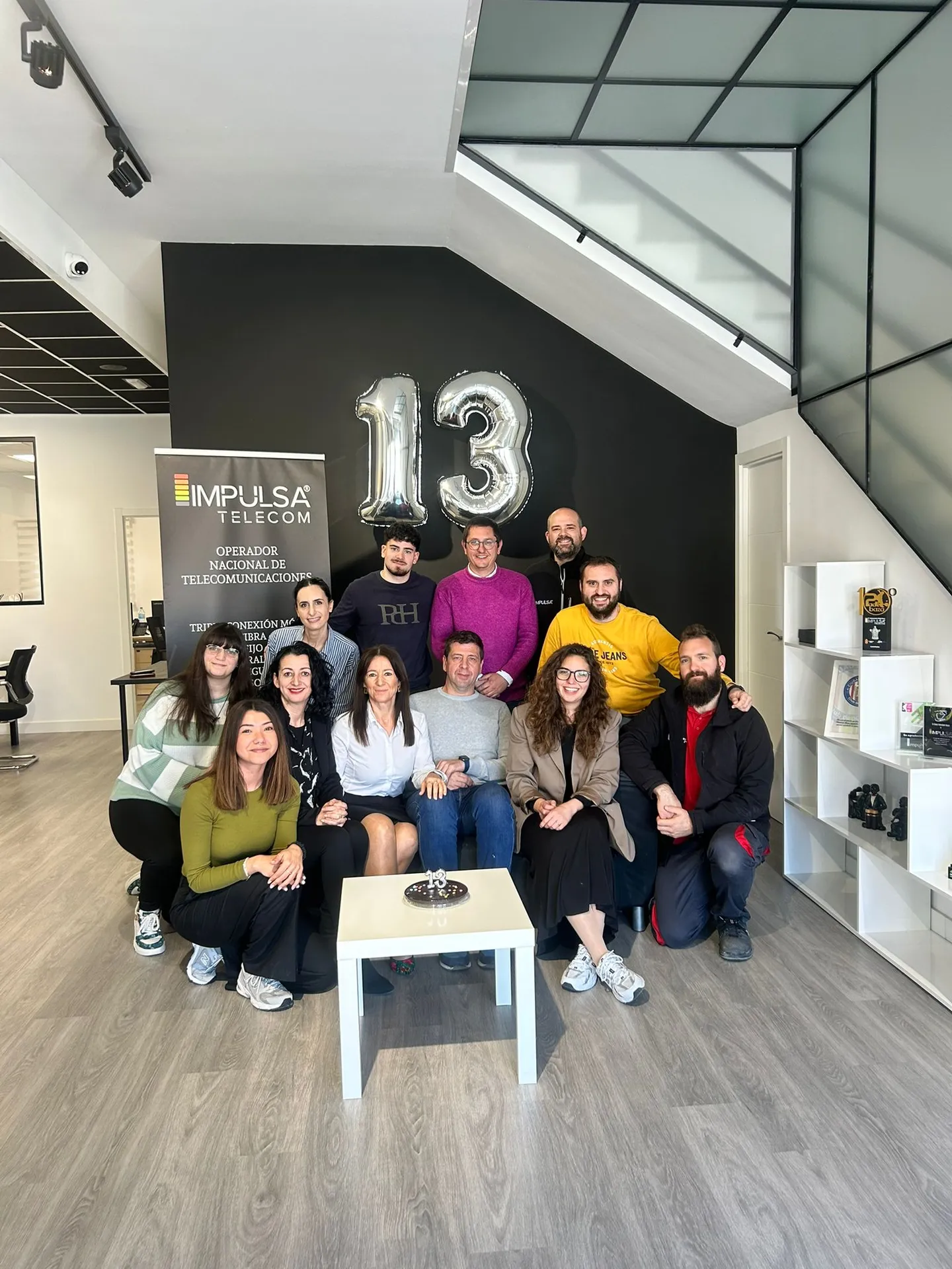 Equipo de Impulsa Telecom celebrando su 13 aniversario